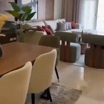 Dining chairs and a sofa in a furnished home