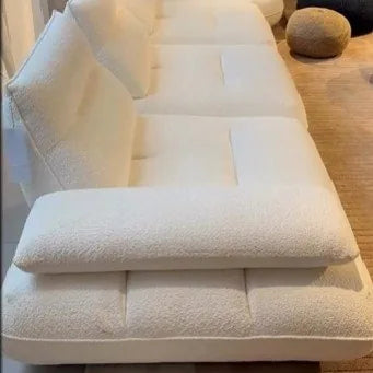 Cream boucle sofa with a chaise